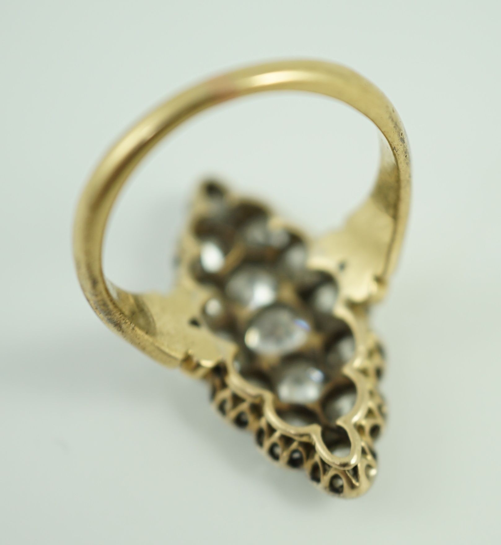 A Victorian style 18ct gold and fifteen stone diamond set marquise cluster dress ring